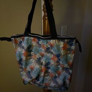 Foldable Tropical Floral Tote with Black Handles Folds Up to Easily Store